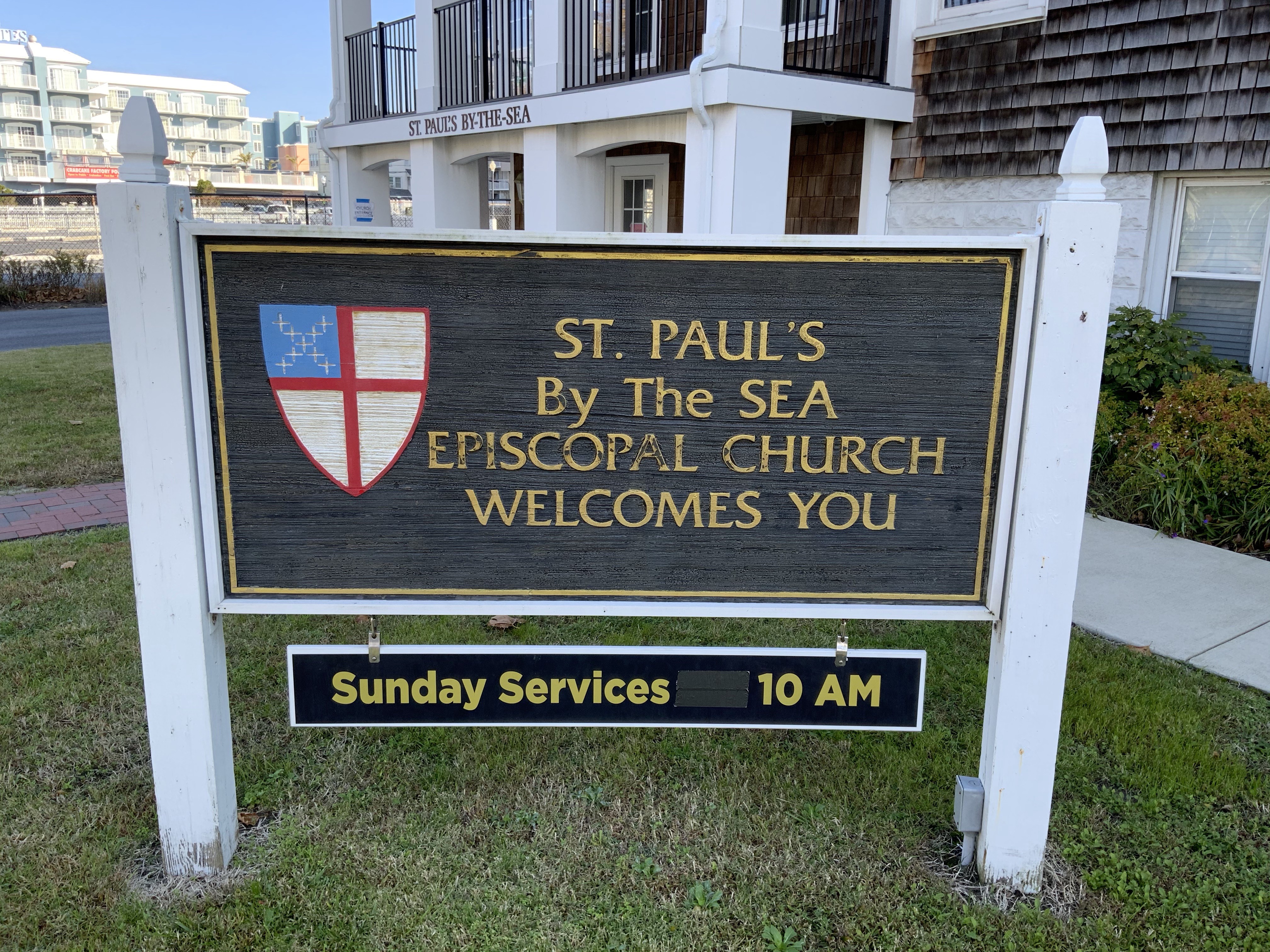 a sign in front of a building that says st paul by the sea episcopal church welcomes you